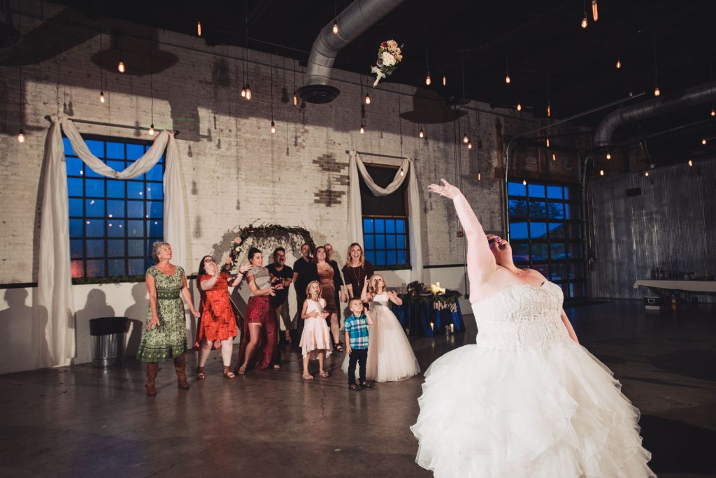 bouquet toss, wedding guests, the brick, wedding at the brick, south bend wedding photographer, south bend wedding venue, candid wedding photos,