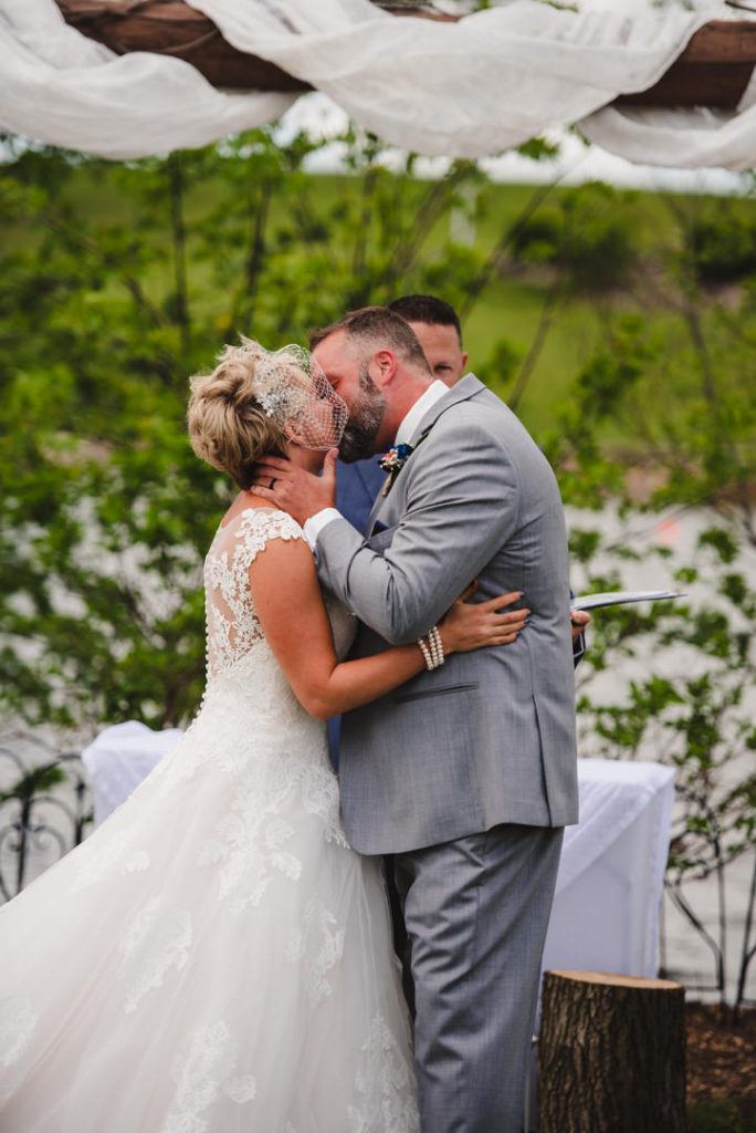 syracuse indiana wedding, wedding photography, farm wedding, blue barn berry farm wedding, outdoor ceremony, vinyard wedding, wedding photographer near me, ceremony, down the aisle, grooms reaction, getting married, outdoor ceremony, first kiss