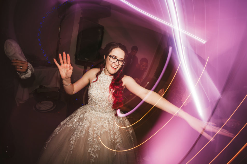 bride dancing, fun lights Westley Leon Studios Wedding Photography Barrelhouse at Zorn in Michigan City