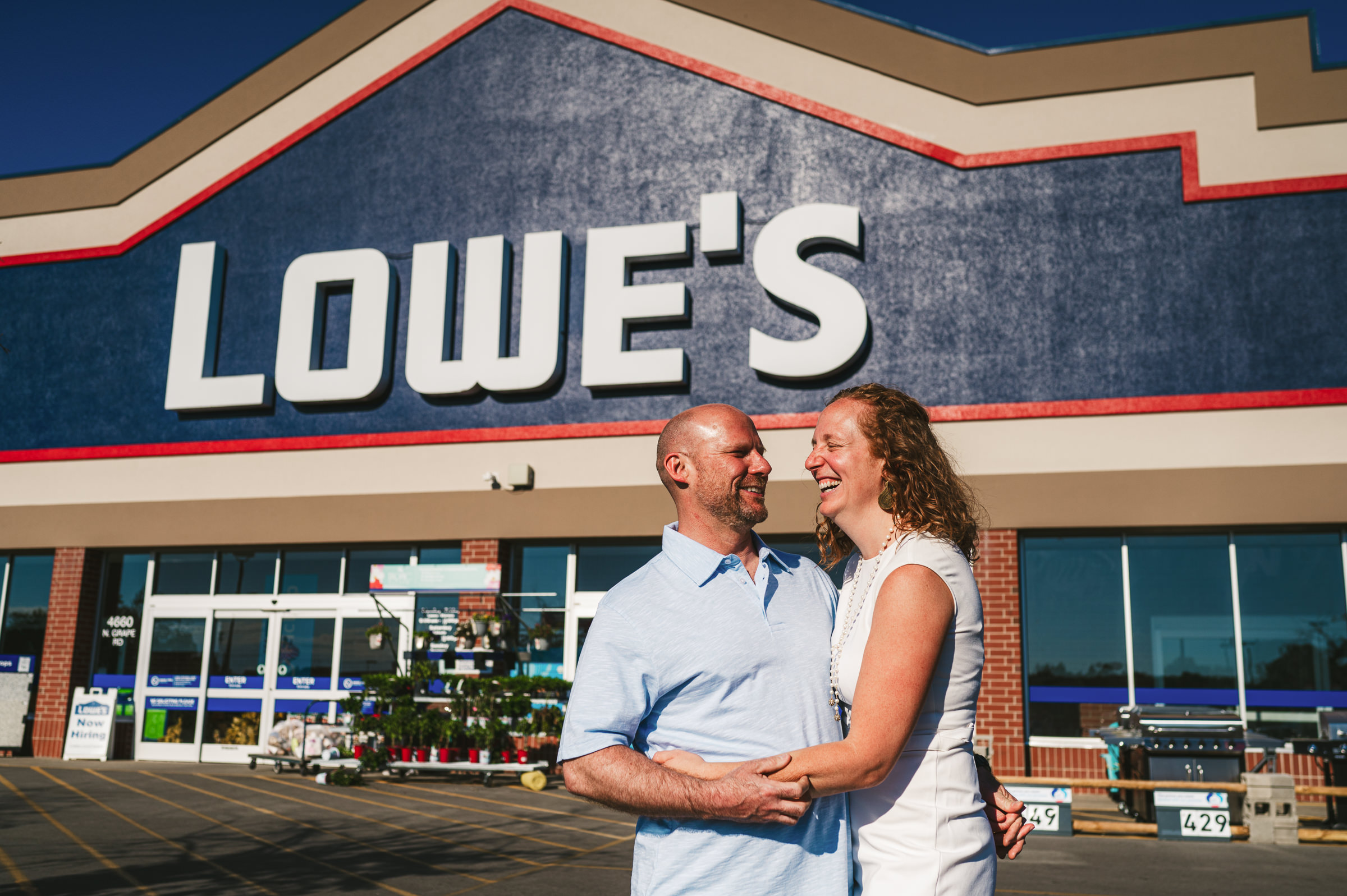 couple holding each other outside of Lowe's Westley Leon Studios Wedding Photographer Lowe's Home Improvement in Mishawaka Indiana