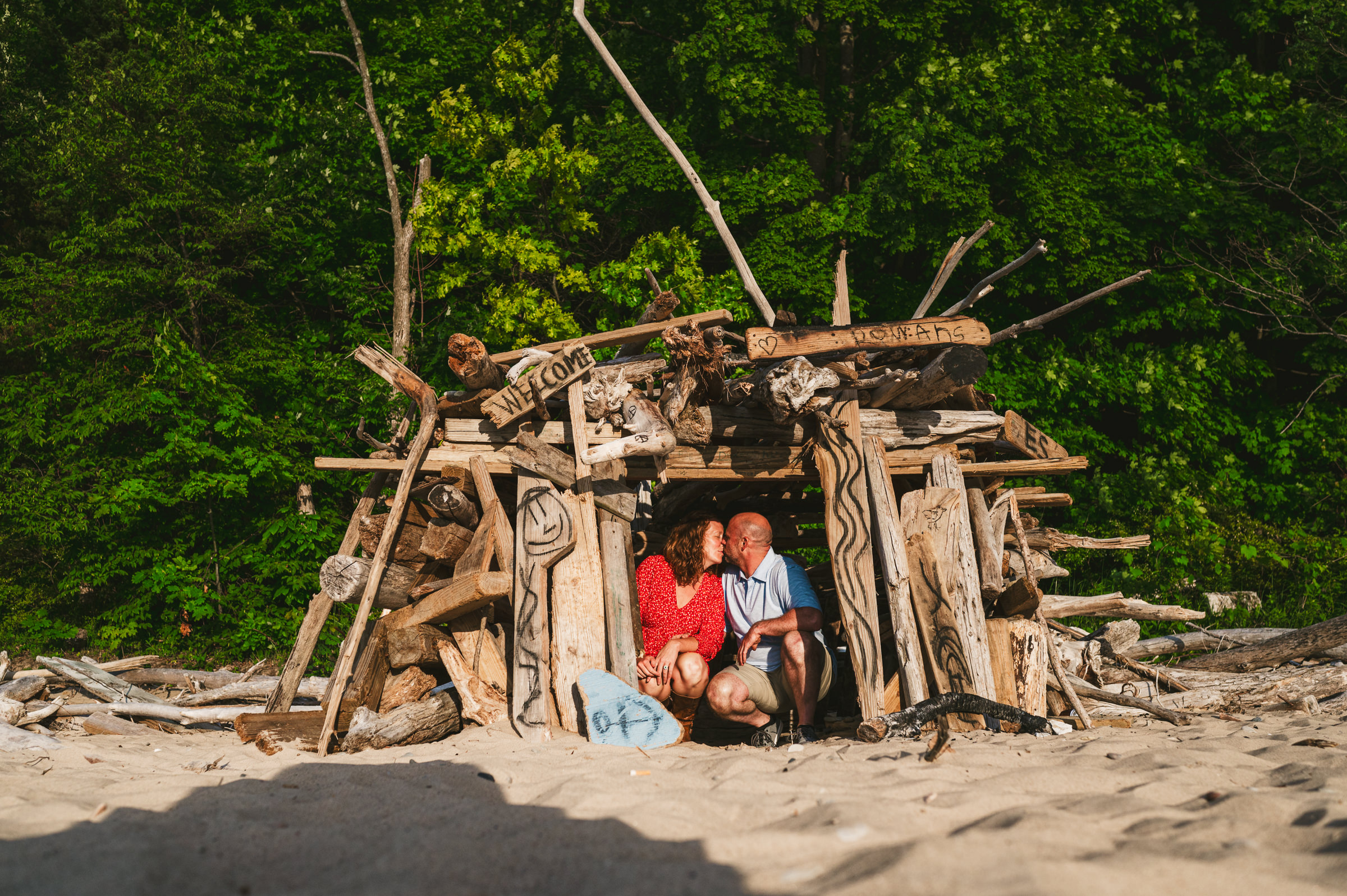 couple sitting in hut on the beach Westley Leon Studios at Rocky Gap Beach in St Joseph Michigan